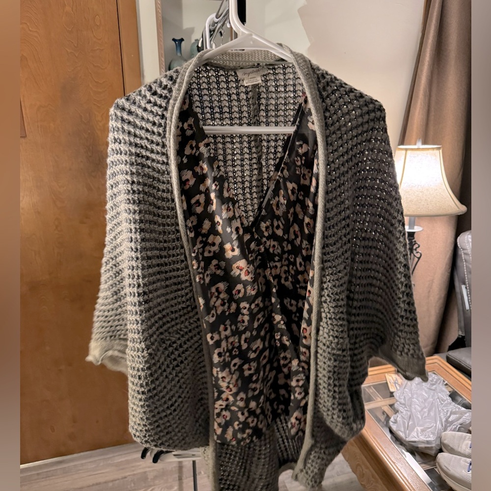 Dressy wrap tank with elastic band at bottom and grey cardigan.